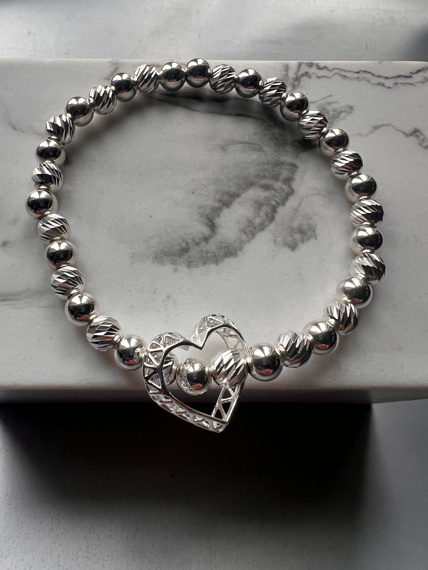 CAGED FLOATING OPEN HEART BRACELET