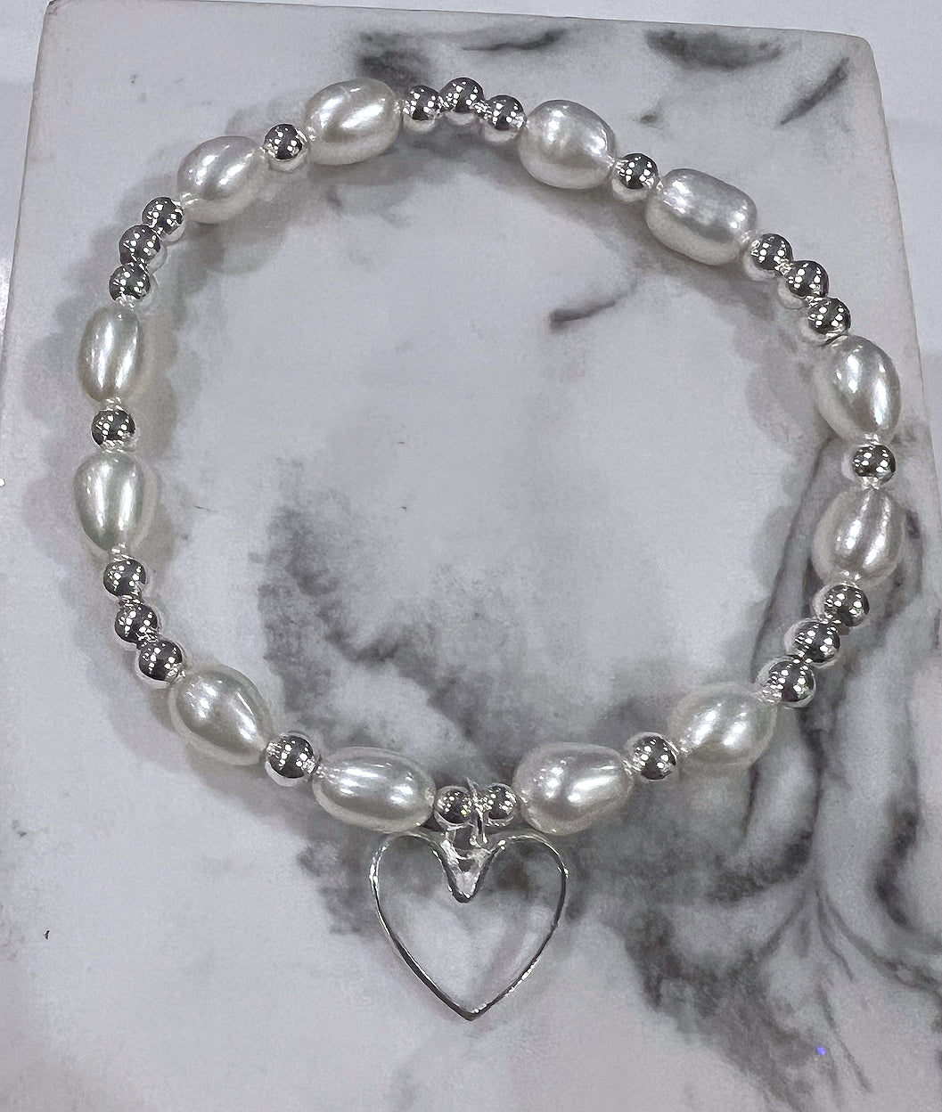 Freshwater pearl and silver open heart bracelet