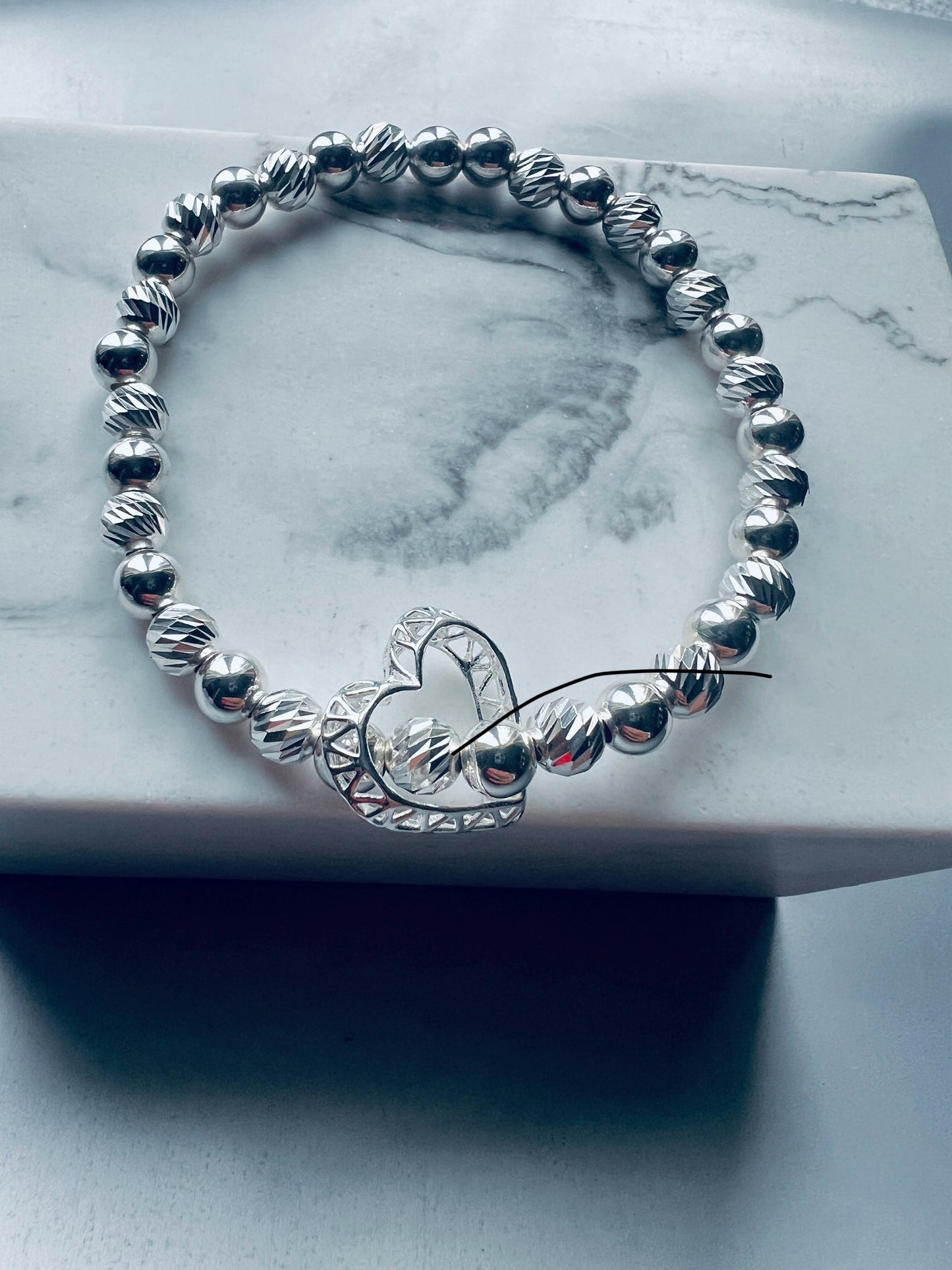 CAGED FLOATING OPEN HEART BRACELET