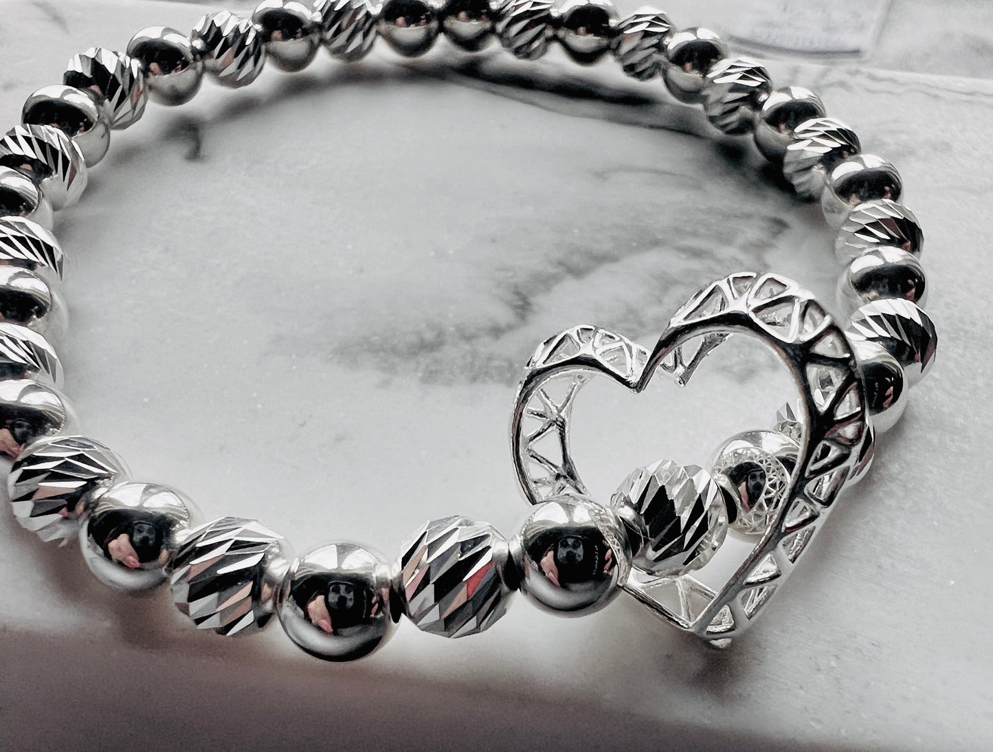 CAGED FLOATING OPEN HEART BRACELET