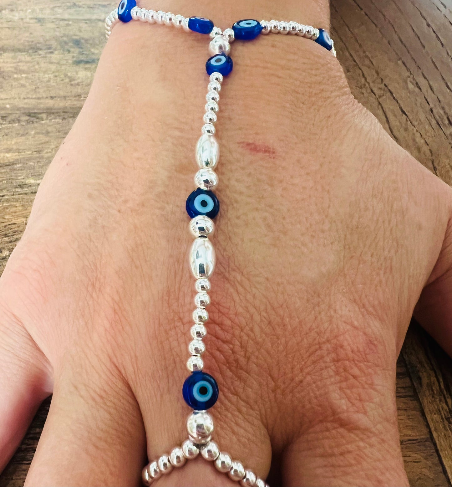 Silver and Evil Eye Glass Hand Bracelet