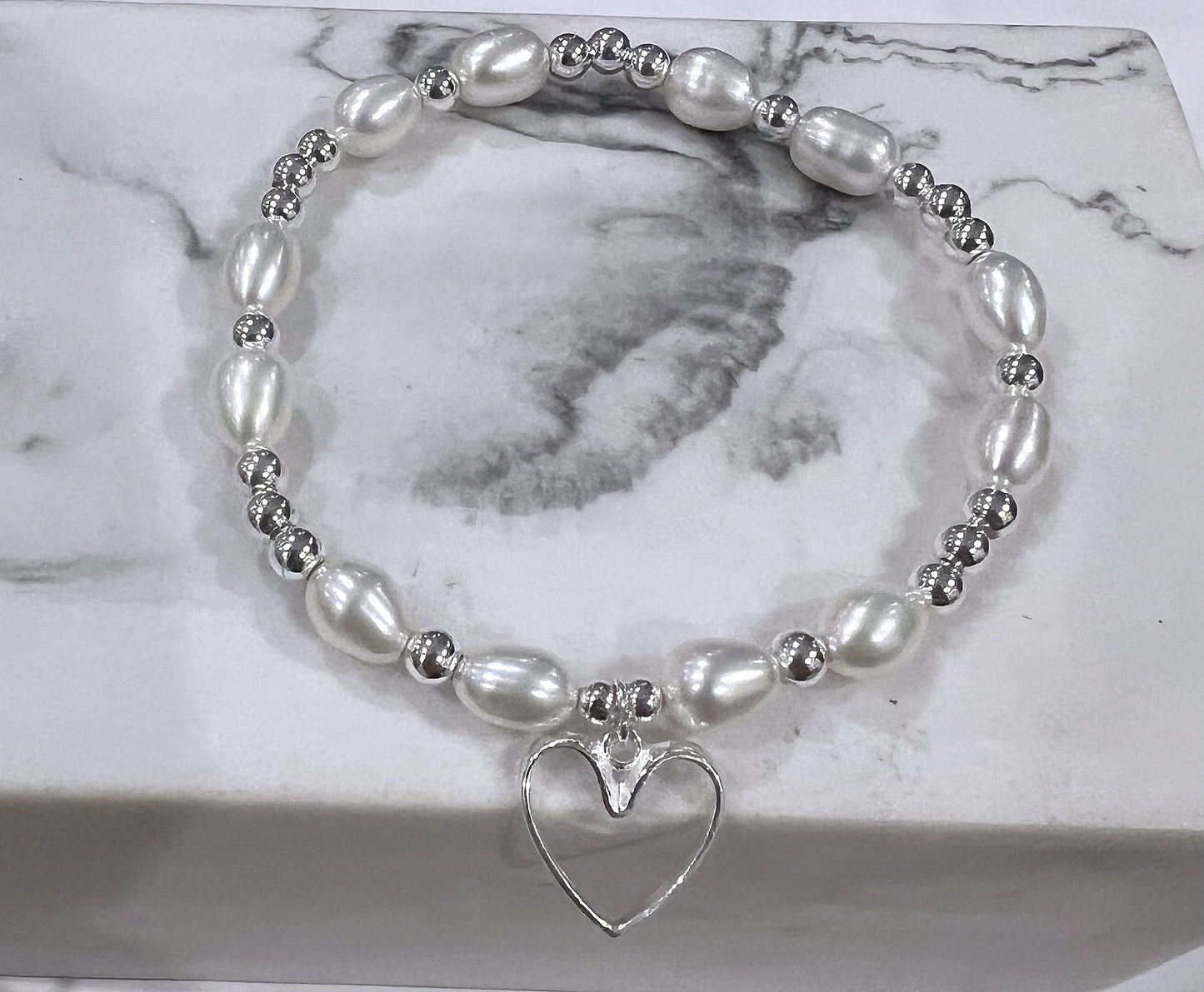 Freshwater pearl and silver open heart bracelet