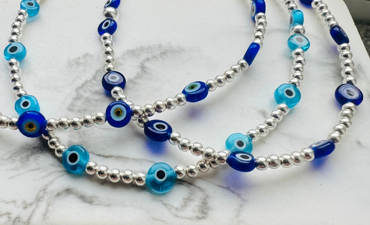 Silver and Evil Eye Glass Hand Bracelet