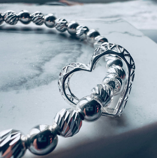 CAGED FLOATING OPEN HEART BRACELET