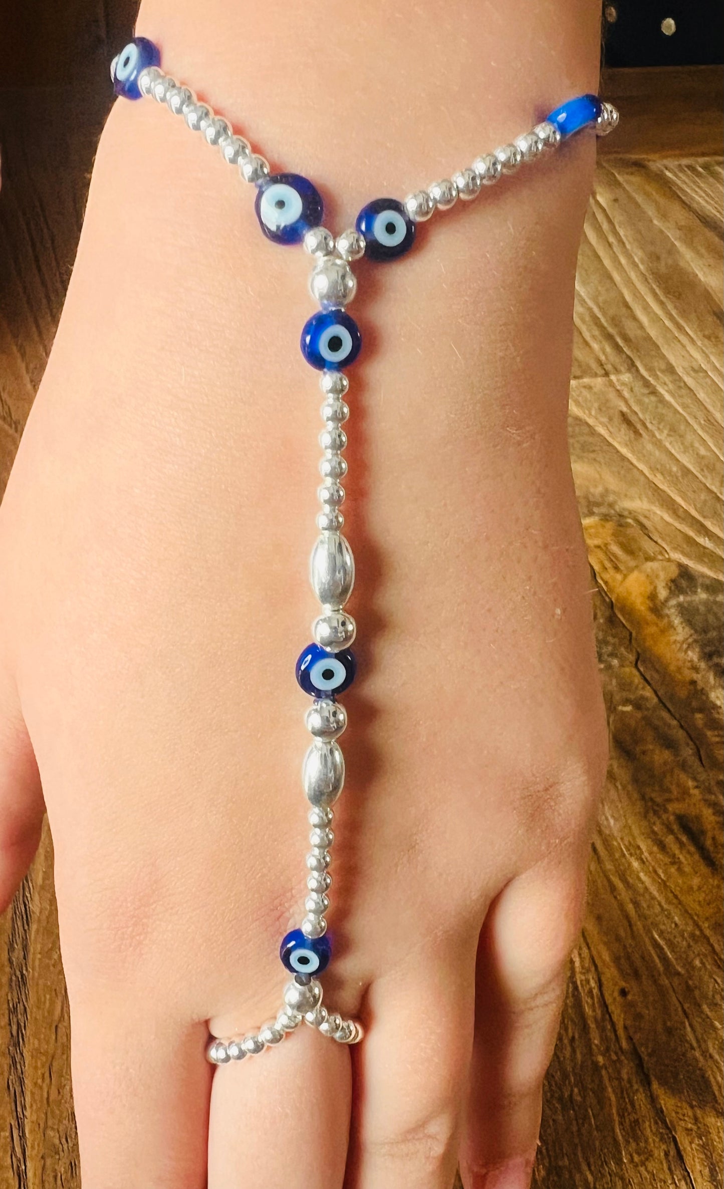 Silver and Evil Eye Glass Hand Bracelet